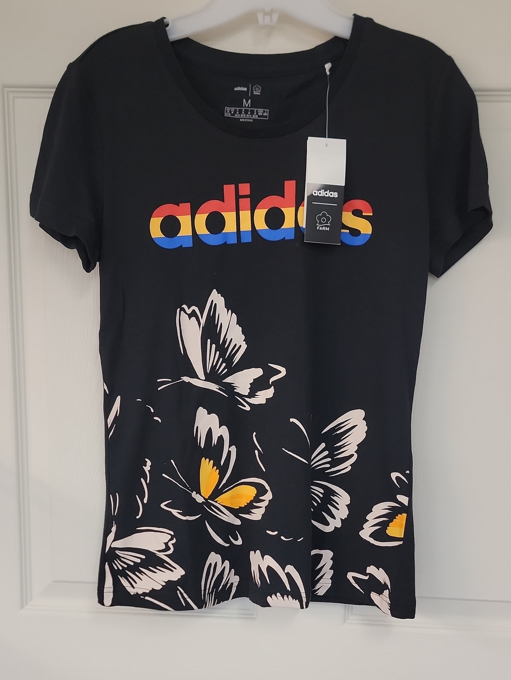 adidas Black Tee with Rainbow Logo and Yellow Butterfly Accents